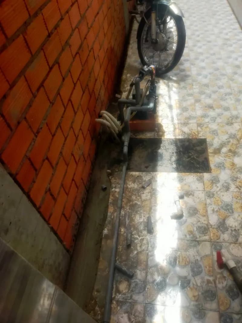 Sau khi hoàn thành sửa máy bơm nước tại Bình Thạnh — thợ Lê Đăng Tuấn
