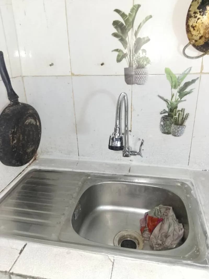 Sau khi hoàn thành sửa vòi rửa chén tại Bình Tân — thợ Trương Công Việt Trân