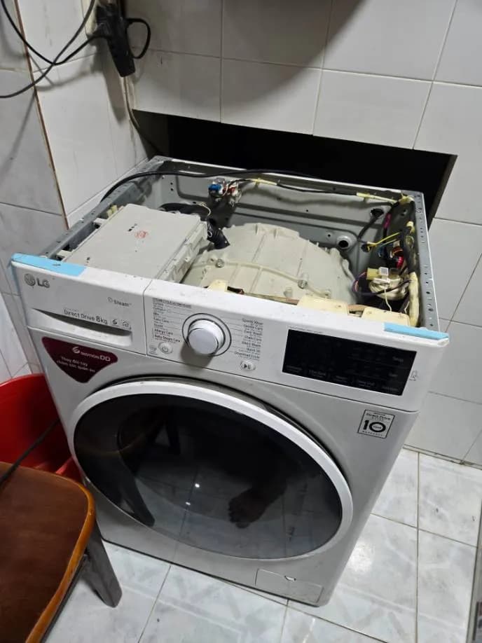 Trước sửa máy giặt cửa trước LG tại Tân Bình — thợ Lê Hữu Lộc