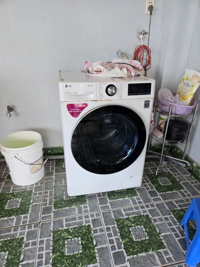 Sau: máy giặt LG cửa trước đã sửa xong, hoạt động bình thường — chi phí 950.000đ
